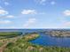 An aerial view of a waterfront community, lush greenery, and access to the open ocean at 925 Eagle Ln, Apollo Beach, FL 33572