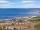 Breathtaking aerial view of a pristine beach, the bay, and a skyline in the distance at 925 Eagle Ln, Apollo Beach, FL 33572