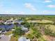 Aerial shot of waterfront homes with backyard boat docks, golf course and beautiful Florida landscape at 925 Eagle Ln, Apollo Beach, FL 33572