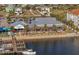 Aerial view of a waterfront restaurant Finn's Dockside with outdoor seating and boat docks at 925 Eagle Ln, Apollo Beach, FL 33572