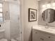 Updated bathroom with new vanity, stylish tile shower, and modern fixtures at 10233 N Valle Dr, Tampa, FL 33612
