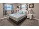 Cozy bedroom with a comfortable bed, bright windows, and relaxing decor at 10233 N Valle Dr, Tampa, FL 33612