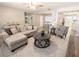 Bright living room featuring a large sectional, modern decor, and open layout at 10233 N Valle Dr, Tampa, FL 33612