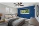 This primary bedroom features a neutral color palette and natural light at 1028 Wyndham Way, Safety Harbor, FL 34695