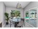 Cozy dining room with pool views and light gray walls at 1028 Wyndham Way, Safety Harbor, FL 34695