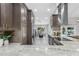 Modern kitchen with stainless steel appliances and an open view to the backyard pool at 1028 Wyndham Way, Safety Harbor, FL 34695