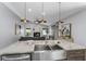 Open concept kitchen featuring stainless steel appliances overlooking the living room at 1028 Wyndham Way, Safety Harbor, FL 34695