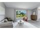 Inviting living room with ample natural light and stylish decor at 1028 Wyndham Way, Safety Harbor, FL 34695