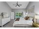 Bright main bedroom with slider door access to the beautiful pool area at 1028 Wyndham Way, Safety Harbor, FL 34695