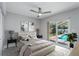 Main bedroom with a view of the lanai and pool at 1028 Wyndham Way, Safety Harbor, FL 34695