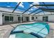 The backyard features a screened pool and patio, perfect for outdoor enjoyment at 1028 Wyndham Way, Safety Harbor, FL 34695