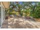 Backyard featuring a fire pit and outdoor seating, perfect for entertaining and relaxing at 10819 Seminole N Dr, St Petersburg, FL 33708