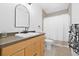 Bathroom featuring a vanity with a white sink and shower/tub with a white shower curtain at 10819 Seminole N Dr, St Petersburg, FL 33708