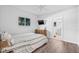 Cozy bedroom with hardwood floors and ensuite bathroom at 10819 Seminole N Dr, St Petersburg, FL 33708