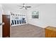 Bright bedroom with hardwood floors featuring bunkbeds and a window with lots of light at 10819 Seminole N Dr, St Petersburg, FL 33708