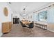 Bright dining room featuring hardwood floors, seating for ten and natural light at 10819 Seminole N Dr, St Petersburg, FL 33708