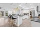 Modern, eat-in kitchen with breakfast bar seating, modern appliances, and ample cabinetry at 10819 Seminole N Dr, St Petersburg, FL 33708