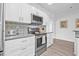 Bright kitchen features stainless steel appliances and stylish backsplash at 10819 Seminole N Dr, St Petersburg, FL 33708