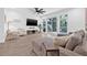 Spacious living room with large windows and sliding glass doors to the patio at 10819 Seminole N Dr, St Petersburg, FL 33708