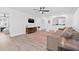 Inviting living room with hardwood floors, a ceiling fan, and an open layout at 10819 Seminole N Dr, St Petersburg, FL 33708