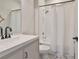 Bathroom showcasing vanity, shower with white tile surround, and decorative floor tile at 1129 Emerald Hill Way, Valrico, FL 33594