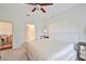 Comfortable bedroom features view of ensuite bathroom and adjacent dining area at 1129 Emerald Hill Way, Valrico, FL 33594