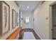 Inviting entryway with wood-look floors and decorative wall art adds a touch of elegance at 1129 Emerald Hill Way, Valrico, FL 33594