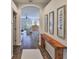 Stylish entryway featuring wood-look flooring, an archway and modern wall decor at 1129 Emerald Hill Way, Valrico, FL 33594