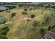 Panoramic aerial view of lush green golf course, with manicured lawns, trees, and scenic water hazards at 1129 Emerald Hill Way, Valrico, FL 33594