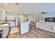 Bright kitchen with an island, white cabinets, and seamless connection to the living area at 1129 Emerald Hill Way, Valrico, FL 33594