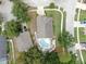 Aerial view of home and backyard pool with surrounding landscape at 11302 Crane Lake Ct, Riverview, FL 33569