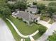 Aerial view of the home showing front yard and backyard pool at 11302 Crane Lake Ct, Riverview, FL 33569