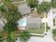 Aerial view of the home and surrounding properties with backyard pool at 11302 Crane Lake Ct, Riverview, FL 33569