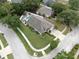 A bird's-eye view of the property highlighting its generous lot size, fully fenced backyard, and inground swimming pool at 11302 Crane Lake Ct, Riverview, FL 33569
