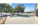 Private backyard boasts a sparkling pool, lush landscaping, shed and mature trees creating a serene oasis at 11302 Crane Lake Ct, Riverview, FL 33569