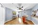 Versatile bedroom with hardwood floors, closet, and stylish desk, ideal for study or creative pursuits at 11302 Crane Lake Ct, Riverview, FL 33569