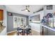 Cozy breakfast nook with a large window, modern light fixture, and adjacent aquarium at 11302 Crane Lake Ct, Riverview, FL 33569