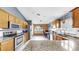Spacious kitchen with stainless steel appliances, granite countertops, and a view of the home office at 11302 Crane Lake Ct, Riverview, FL 33569