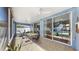 Entertainers lanai featuring tile floors, dining area, and scenic view of the sparkling pool and backyard at 11302 Crane Lake Ct, Riverview, FL 33569