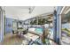 Inviting lanai features ample seating, dining area, and a view of the sparkling pool and lush backyard at 11302 Crane Lake Ct, Riverview, FL 33569