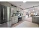 Modern kitchen with stainless steel appliances, sleek cabinets, and a view to living space at 1203 E 33Rd Ave, Tampa, FL 33603