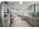 Well-lit kitchen showcasing updated cabinets, stainless steel appliances, and an open layout for easy entertaining at 1203 E 33Rd Ave, Tampa, FL 33603