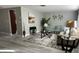 Cozy living room featuring neutral tones, stylish décor, wood-look floors, and comfortable seating at 12415 Stagecoach Ln, Hudson, FL 34667
