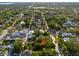 A residential neighborhood with tree-lined streets and various styles of homes are seen from an aerial view at 132 21St S Ave, St Petersburg, FL 33705