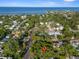 Beautiful aerial view of a tree-lined neighborhood with a glimpse of the ocean in the background at 132 21St S Ave, St Petersburg, FL 33705