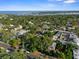 Picturesque aerial view of the neighborhood, showcasing houses, trees, and the ocean in the distance at 132 21St S Ave, St Petersburg, FL 33705