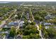 A residential neighborhood with tree-lined streets and various styles of homes are seen from an aerial view at 132 21St S Ave, St Petersburg, FL 33705
