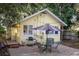 Inviting backyard features a brick patio with grill, umbrella, and dining set, perfect for outdoor gatherings at 132 21St S Ave, St Petersburg, FL 33705