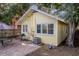 The backyard brick patio offers outdoor living space with an AC unit and a grill for entertaining at 132 21St S Ave, St Petersburg, FL 33705