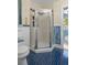 Step-in shower with tile surround, toilet and sink are all features of this charming full bathroom at 132 21St S Ave, St Petersburg, FL 33705